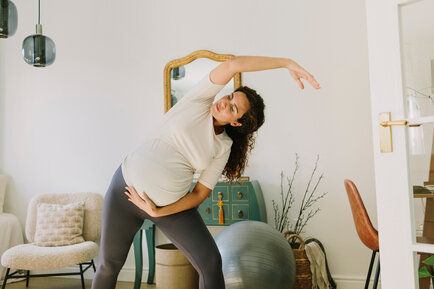 Pregnant person doing yoga
