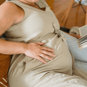 Pregnant woman smiling during prenatal physiotherapy session